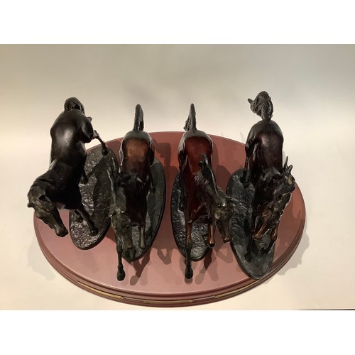 71 - A set of four Franklin Mint bronze model horses, The Origins of Champions, Darley Arabian, modelled ... 