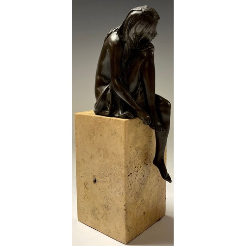 74 - A bronze sculpture, of a seated girl, signed Milo, rectangular marble base, 27cm high