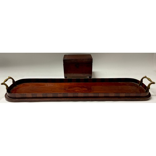 81 - A Georgian mahogany rectangular tea caddy; a mahogany elongated serving tray, inlaid with shell pate... 