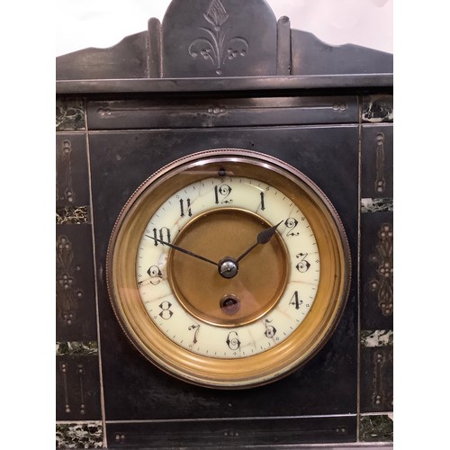 180 - A 19th century belge noir mantel clock, 33cm high