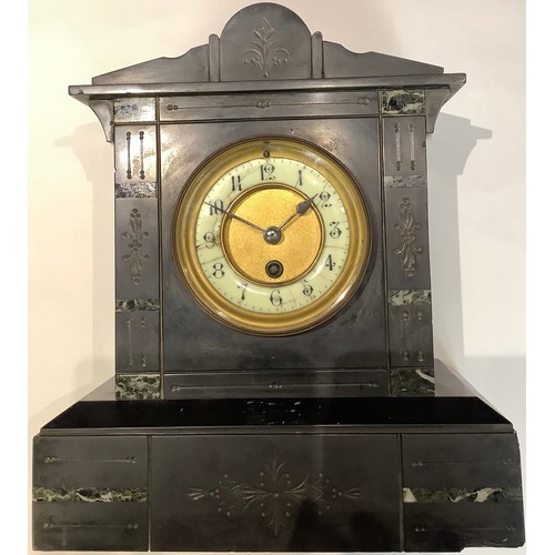 180 - A 19th century belge noir mantel clock, 33cm high