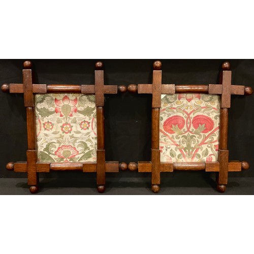 219 - A pair of Arts and Crafts oak frames, each with 'William Morris' textile panels, 43.5cm x 40cm