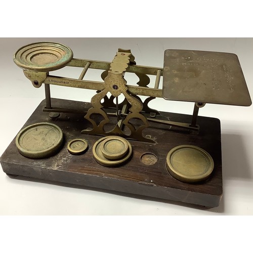 470 - A set of early 20th century brass postal balance scales,  S. Mordan & Co., with weights, 26cm wide