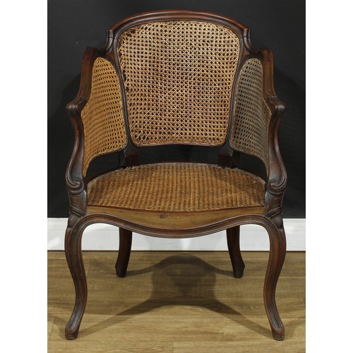 104 - A French Hepplewhite Revival mahogany bergère marquise chair, cane back and seat, cabriole legs, 88.... 