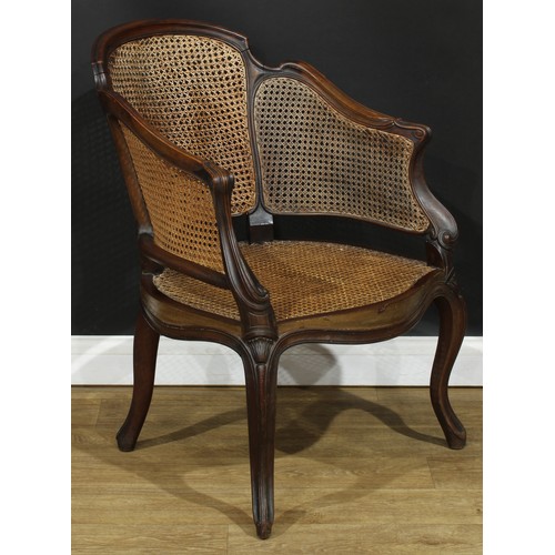 104 - A French Hepplewhite Revival mahogany bergère marquise chair, cane back and seat, cabriole legs, 88.... 