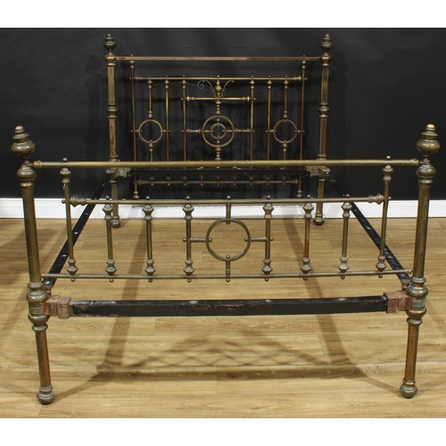 203 - A late Victorian Aesthetic Movement bed, the headboard 124cm high, the internal dimensions 138cm x 1... 