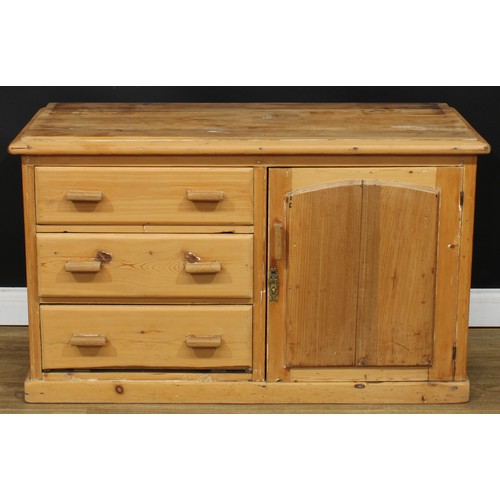 205 - A Victorian farmhouse pine low dresser, rectangular top above three short drawers neighboured by a p... 