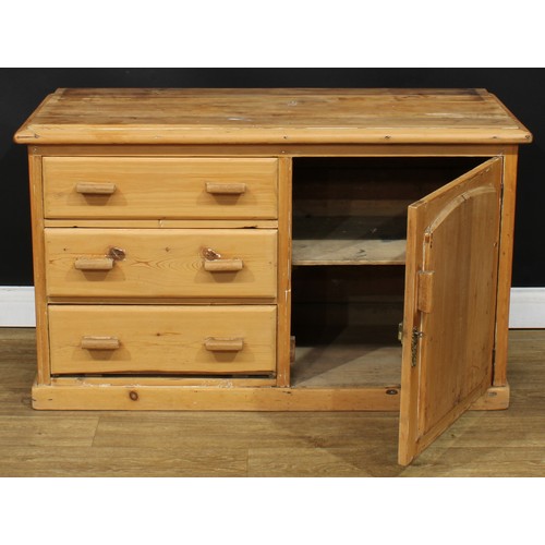 205 - A Victorian farmhouse pine low dresser, rectangular top above three short drawers neighboured by a p... 