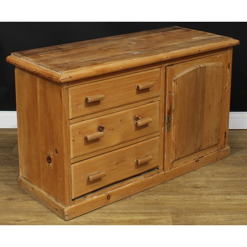 205 - A Victorian farmhouse pine low dresser, rectangular top above three short drawers neighboured by a p... 