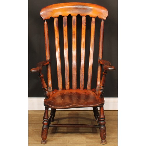 309 - A Victorian beech and elm lath back elbow chair, 101cm high, 63.5cm wide, the seat 37.5cm wide and 4... 