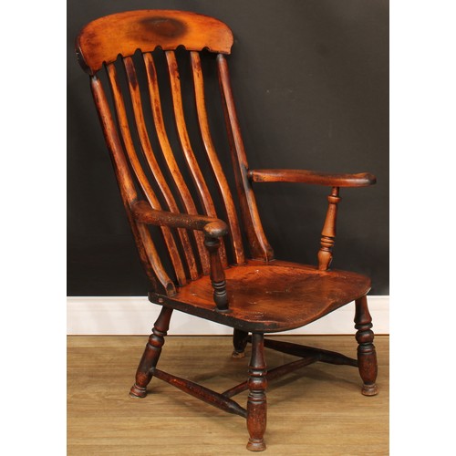 309 - A Victorian beech and elm lath back elbow chair, 101cm high, 63.5cm wide, the seat 37.5cm wide and 4... 