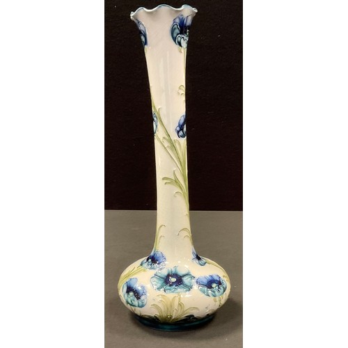 42 - A Moorcroft McIntyre Blue Poppy vase, long neck and bulbous body, tube lined with flowerheads and fo... 