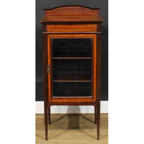 582 - An Edwardian satinwood banded mahogany music room cabinet, rectangular top with shaped half-gallery ... 