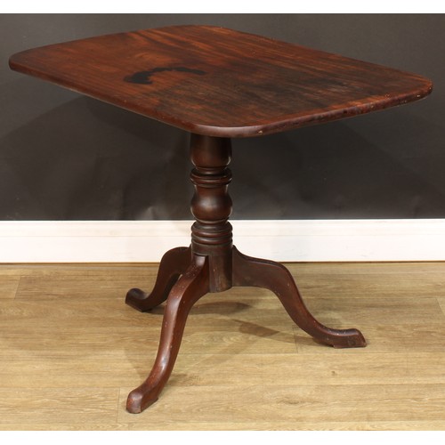 583 - A 19th century mahogany tripod occasional table, rounded rectangular tilting top, turned column, cab... 