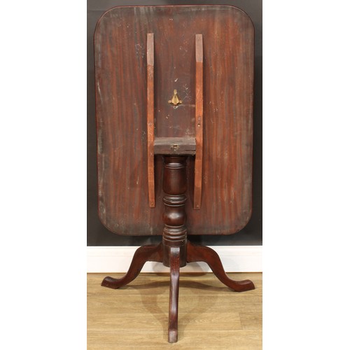 583 - A 19th century mahogany tripod occasional table, rounded rectangular tilting top, turned column, cab... 