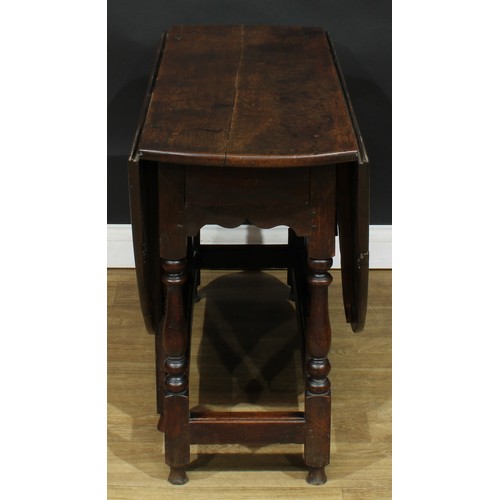 587 - A late 18th century oak gateleg table, 69cm high, 42cm opening to 143.5cm long, 110cm wide; an early... 