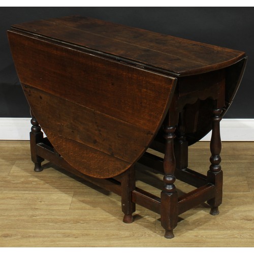 587 - A late 18th century oak gateleg table, 69cm high, 42cm opening to 143.5cm long, 110cm wide; an early... 