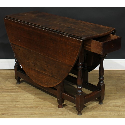 587 - A late 18th century oak gateleg table, 69cm high, 42cm opening to 143.5cm long, 110cm wide; an early... 