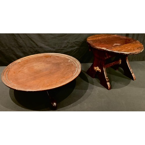 608 - A mahogany Lazy Susan, tripod base, 48cm diam;  a small oval drop leaf side table/stool, 26cm high, ... 