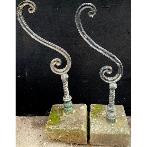 3002 - A pair of 19th century cast iron garden balustrade ends, the S scrolls supported on turned columns, ... 