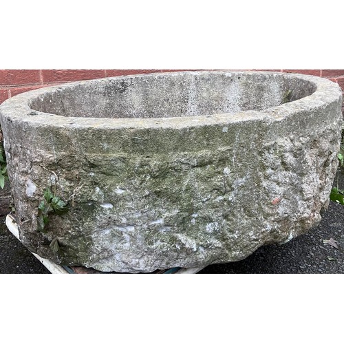 3023 - A 19th century Derbyshire oval gritstone trough, 33cm high, 91cm wide


**Please note that some of t... 