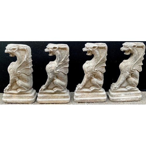 3030 - A set of four composition architectural caryatids, each modelled as a griffin, 49cm high


**Please ... 