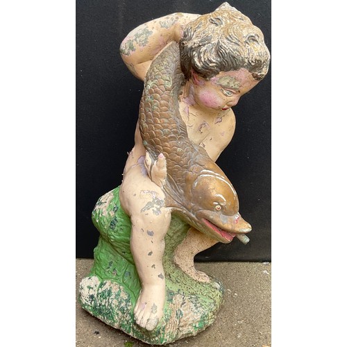 3013 - A composite garden fountain, now painted, as a putti holding a carp, 62cm high

**Please note that s... 