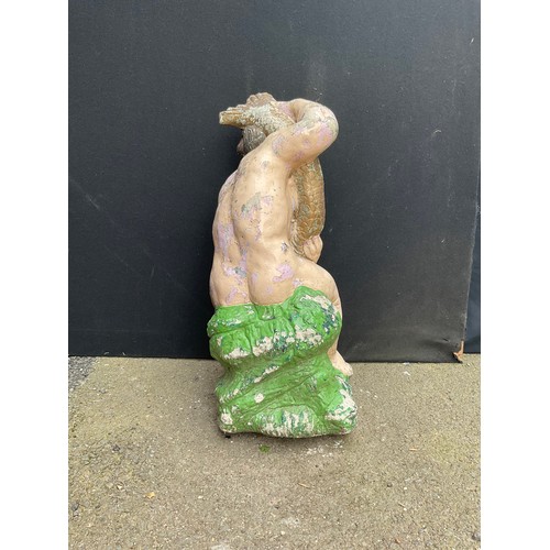 3013 - A composite garden fountain, now painted, as a putti holding a carp, 62cm high

**Please note that s... 