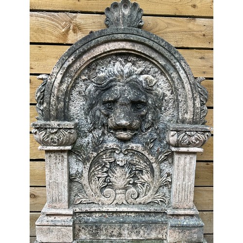 3029 - A 19th century marble  lion head wall fountain, the arched back carved with lion and acanthus scroll... 