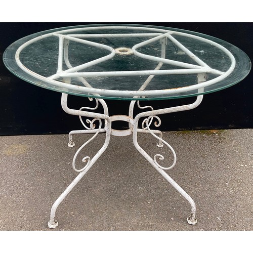 3009 - A circular patio table, glass top, scroll base, 100cm diam, 73cm high

**Please note that some of th... 