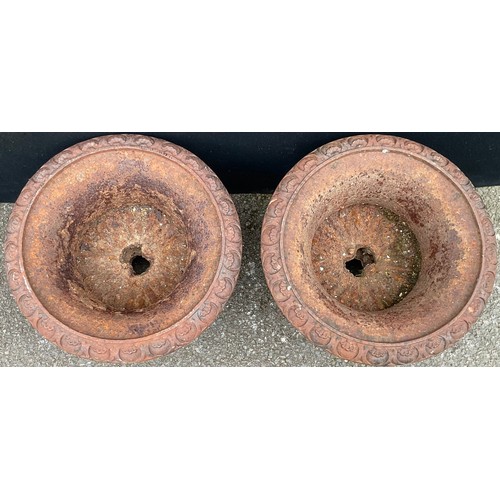 3054 - A pair of cast iron half fluted campana shaped urns, the rims cast with shell and roundels, square b... 