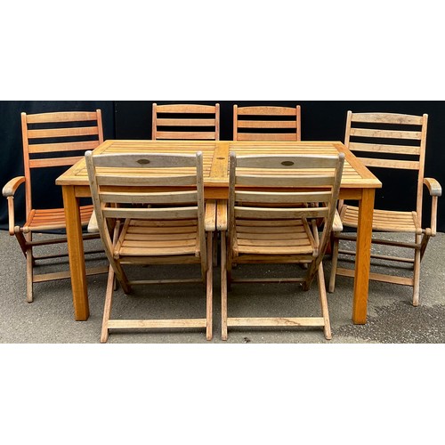 3062 - A hardwood garden table and six folding armchairs, by Royal Craft, labelled, the table 74cm high, 15... 