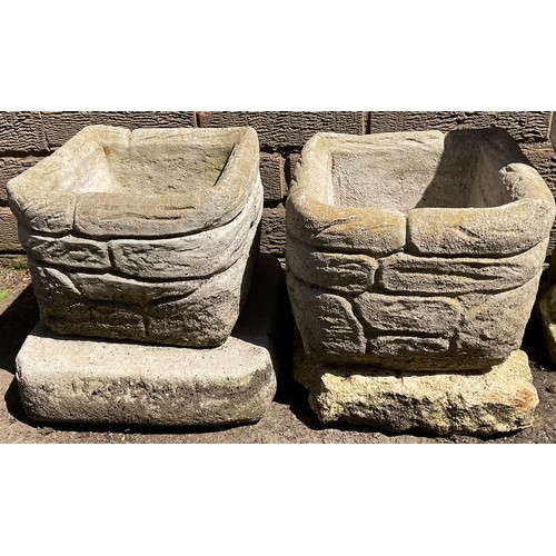 3003 - A pair of square stone 'brick' planters, on stands, 23cm wide, 26cm high;  a garden stature, Allegor... 