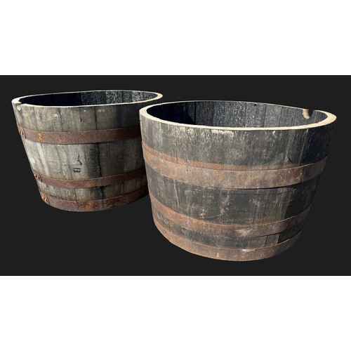 3162 - A pair of half barrel planters, 63cm  diam, 41cm high



**Please note that this  lot in this auctio... 