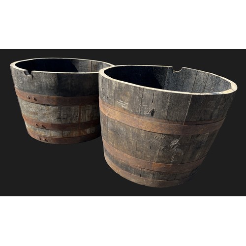 3173 - A pair of half barrel planters, 63cm diam, 41cm high

**Please note that this  lot in this auction i... 