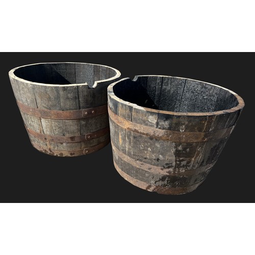 3165 - A pair of half barrel planters, 63cm  diam, 41cm high 

**Please note that this  lot in this auction... 