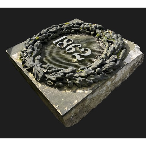 3100 - A square stone insert, 1862 within an oak leaf and acorn wreath, 91cm high, 94cm wide, 28cm deep

**... 