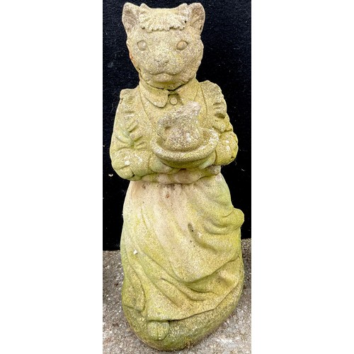 3061 - A reconstituted garden statue, of a dog, reclining, 50cm wide;  another, of Mrs Tabitha Twitchet, 56... 