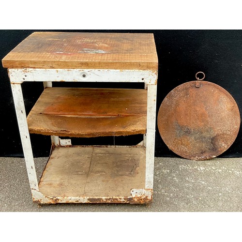 3074 - A two tier work bench, 85cm high, 65cm wide;  a cast iron circular plate, 53cm diam (2)


**Please n... 