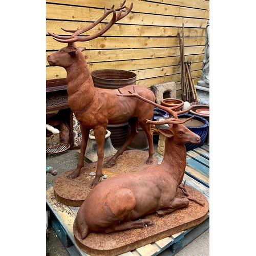 3088 - A large iron garden statue, naturalistically cast as a red deer stag, 145cm high; another, 83cm high... 