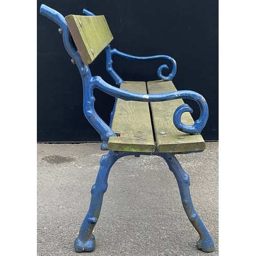 3127 - A cast iron and wood garden bench, branch effect scroll arms, now painted blue length 145.5cm height... 