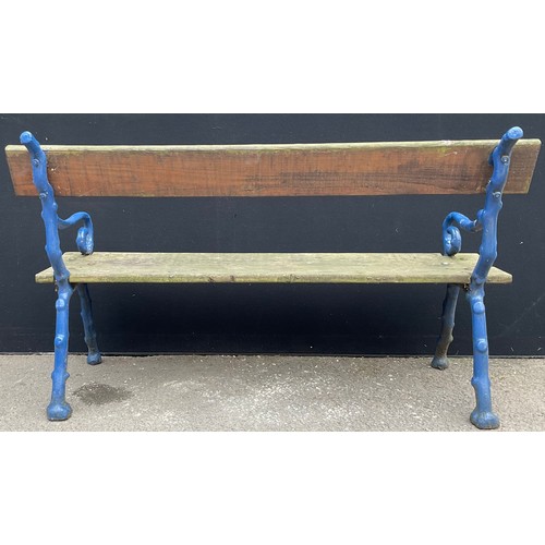 3127 - A cast iron and wood garden bench, branch effect scroll arms, now painted blue length 145.5cm height... 