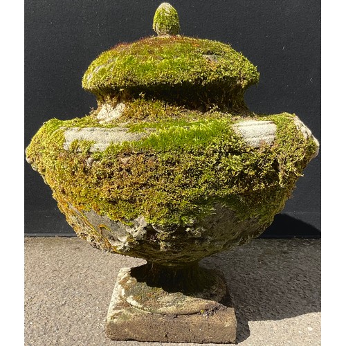 3128 - A composite garden urn, moulded with swags, lion heads to sides, square base


**Please note that so... 