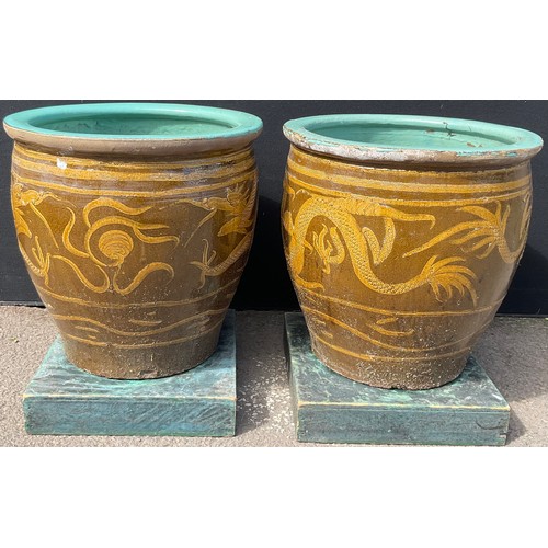 3130 - A pair of glazed dragon pots height 49.5cm by 50cm


**Please note that some of the lots in this auc... 