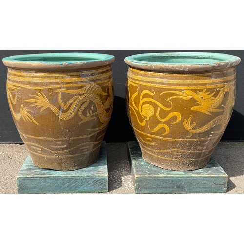 3130 - A pair of glazed dragon pots height 49.5cm by 50cm


**Please note that some of the lots in this auc... 