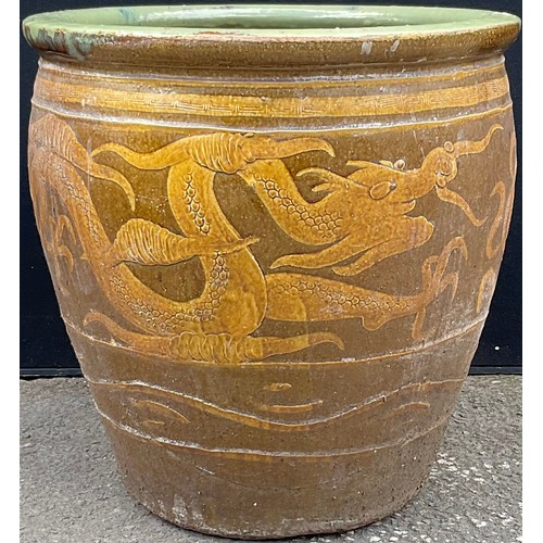 3131 - A garden planter, decorated with a dragon in mustard, on a tan ground


**Please note that some of t... 