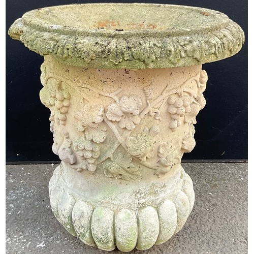 3136 - A composite garden urn, moulded with grapes and vine, fluted base width 57cm height 60cm



**Please... 