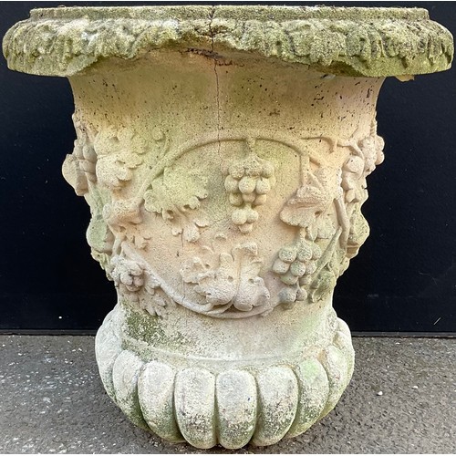 3136 - A composite garden urn, moulded with grapes and vine, fluted base width 57cm height 60cm



**Please... 