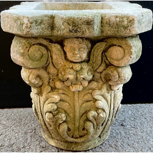 3072 - A  reconstituted capital, moulded with cherubs and acanthus leaves, 31cm high, 39cm wide


**Please ... 