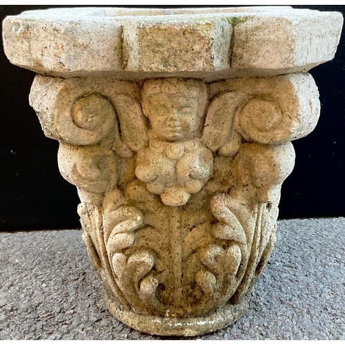 3072 - A  reconstituted capital, moulded with cherubs and acanthus leaves, 31cm high, 39cm wide


**Please ... 